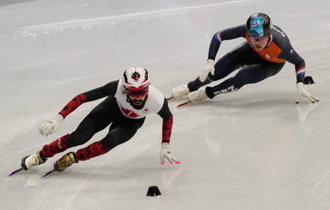 (260219) -- MILAN, Feb. 19, 2026 -- Steven Dubois (L) of Canada and Melle van t Wout of the Netherlands compete during the short track Speed skating, Eisschnelllauf men s 500m final A at the Milan-Cortina 2026 Olympic Winter games, Winterspiele,Spiele, Summer games in Milan, Italy, Feb. 18, 2026. ) (MICO2026)ITALY-MILAN-OLYMPIC WINTER GAMES-SHORT TRACK SPEED SKATING-MEN S 500M-FINALS LaixXiangdong 