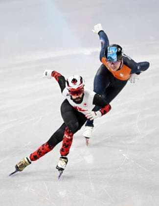 (260219) -- MILAN, Feb. 19, 2026 -- Steven Dubois (L) of Canada and Melle van t Wout of the Netherlands compete during the short track Speed skating, Eisschnelllauf men s 500m final A at the Milan-Cortina 2026 Olympic Winter games, Winterspiele,Spiele, Summer games in Milan, Italy, Feb. 18, 2026. ) (MICO2026)ITALY-MILAN-OLYMPIC WINTER GAMES-SHORT TRACK SPEED SKATING-MEN S 500M-FINALS ChengxMin 