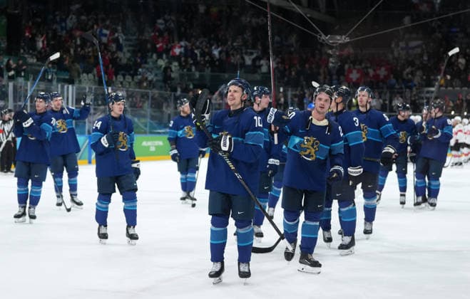 (260219) -- MILAN, Feb. 19, 2026 -- Players of Finland celebrate victory after the Ice hockey, Eishockey men s play-offs quarterfinal between Finland and Switzerland at the Milan-Cortina 2026 Olympic Winter games, Winterspiele,Spiele, Summer games in Milan, Italy, Feb. 18, 2026. ) (MICO2026)ITALY-MILAN-OLYMPIC WINTER GAMES-ICE HOCKEY-MEN-PLAY-OFFS QUARTERFINALS-FIN VS SUI SunxFei 