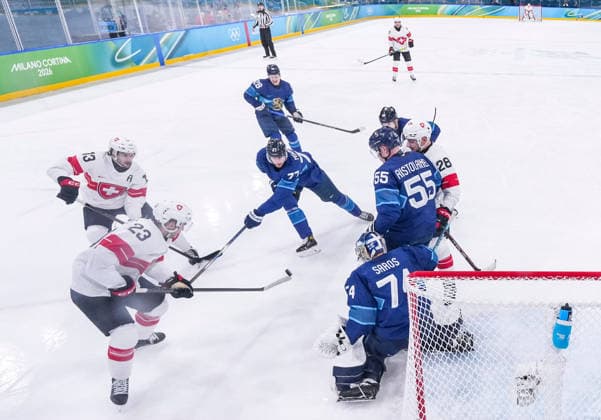 (260219) -- MILAN, Feb. 19, 2026 -- Players of both teams compete during the Ice hockey, Eishockey men s play-offs quarterfinal between Finland and Switzerland at the Milan-Cortina 2026 Olympic Winter games, Winterspiele,Spiele, Summer games in Milan, Italy, Feb. 18, 2026. ) (MICO2026)ITALY-MILAN-OLYMPIC WINTER GAMES-ICE HOCKEY-MEN-PLAY-OFFS QUARTERFINALS-FIN VS SUI SunxFei 