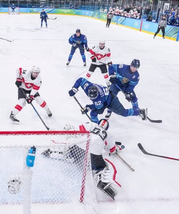 (260219) -- MILAN, Feb. 19, 2026 -- Leonardo Genoni (bottom), goalkeeper of Switzerland makes a save during the Ice hockey, Eishockey men s play-offs quarterfinal between Finland and Switzerland at the Milan-Cortina 2026 Olympic Winter games, Winterspiele,Spiele, Summer games in Milan, Italy, Feb. 18, 2026. ) (MICO2026)ITALY-MILAN-OLYMPIC WINTER GAMES-ICE HOCKEY-MEN-PLAY-OFFS QUARTERFINALS-FIN VS SUI SunxFei 