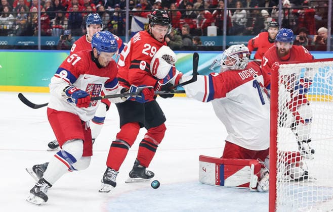 (260219) -- MILAN, Feb. 19, 2026 -- Players of both teams vie for the puck during the Ice hockey, Eishockey men s play-offs quarterfinals match between Canada and the Czech Republic at the Milan-Cortina 2026 Olympic Winter games, Winterspiele,Spiele, Summer games in Milan, Italy, Feb. 18, 2026. ) (MICO2026)ITALY-MILAN-OLYMPIC WINTER GAMES-ICE HOCKEY-MEN-PLAY-OFFS QUARTERFINALS-CAN VS CZE WangxKaiyan 