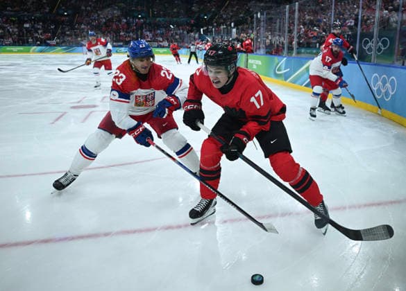 (260219) -- MILAN, Feb. 19, 2026 -- Lukas Sedlak (L) of the Czech Republic vies with Macklin Celebrini of Canada during the Ice hockey, Eishockey men s play-offs quarterfinals match between Canada and the Czech Republic at the Milan-Cortina 2026 Olympic Winter games, Winterspiele,Spiele, Summer games in Milan, Italy, Feb. 18, 2026. ) (MICO2026)ITALY-MILAN-OLYMPIC WINTER GAMES-ICE HOCKEY-MEN-PLAY-OFFS QUARTERFINALS-CAN VS CZE ZhangxHaofu 