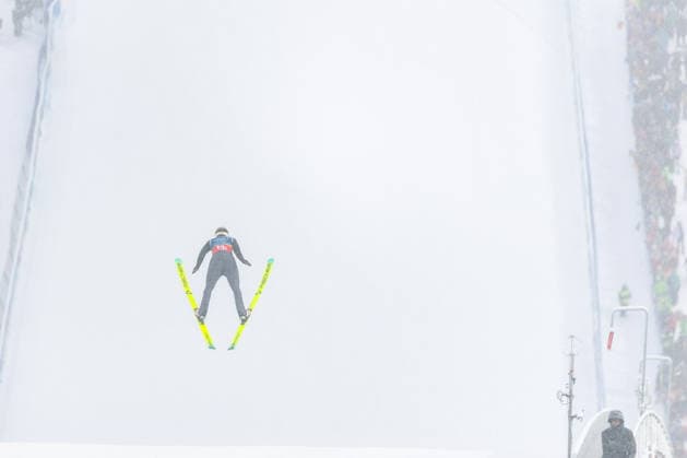 (260219) -- PREDAZZO, Feb. 19, 2026 -- Johannes Rydzek of Germany competes during the Ski jumping, Skispringen, Ski, nordisch trial round of the nordic combined team sprint at the 2026 Milan-Cortina Winter Olympics in Predazzo, Italy, Feb. 19, 2026. ) (MICO2026)ITALY-PREDAZZO-OLYMPIC Winter games, Winterspiele,Spiele, Summer games NORDIC COMBINED-TEAM SPRINT HuangxWei 
