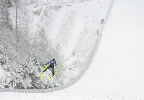 (260219) -- PREDAZZO, Feb. 19, 2026 -- Zhao Jiawen of China competes during the Ski jumping, Skispringen, Ski, nordisch competition round of the nordic combined team sprint at the 2026 Milan-Cortina Winter Olympics in Predazzo, Italy, Feb. 19, 2026. ) (MICO2026)ITALY-PREDAZZO-OLYMPIC Winter games, Winterspiele,Spiele, Summer games NORDIC COMBINED-TEAM SPRINT MengxYongmin 