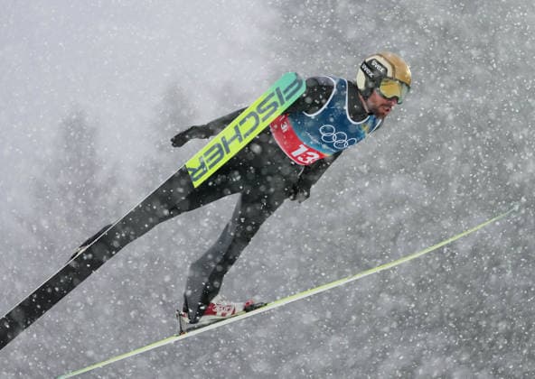(260219) -- PREDAZZO, Feb. 19, 2026 -- Johannes Rydzek of Germany competes during the Ski jumping, Skispringen, Ski, nordisch competition round of the nordic combined team sprint at the 2026 Milan-Cortina Winter Olympics in Predazzo, Italy, Feb. 19, 2026. ) (MICO2026)ITALY-PREDAZZO-OLYMPIC Winter games, Winterspiele,Spiele, Summer games NORDIC COMBINED-TEAM SPRINT MengxYongmin 