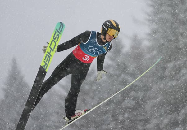 (260219) -- PREDAZZO, Feb. 19, 2026 -- Zhao Zihe of China competes during the Ski jumping, Skispringen, Ski, nordisch competition round of the nordic combined team sprint at the 2026 Milan-Cortina Winter Olympics in Predazzo, Italy, Feb. 19, 2026. ) (MICO2026)ITALY-PREDAZZO-OLYMPIC Winter games, Winterspiele,Spiele, Summer games NORDIC COMBINED-TEAM SPRINT MengxYongmin 