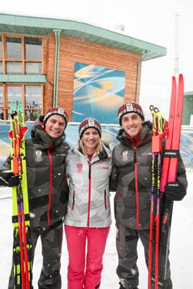 OLYMPICS - Winter Olympic Games, Olympische Spiele, Olympia, OS Milano Cortina 2026 TESERO,ITALY,19.FEB.26 - OLYMPICS, NORDIC SKIING, NORDIC COMBINED, CROSS COUNTRY - Winter Olympic Games Milano Cortina 2026, team sprint, 2x7.5km. Image shows Johannes Lamparter, secretary of state Michaela Schmidt and Stefan Rettenegger (AUT).  GEPAxpictures xMatthiasxTrinkl