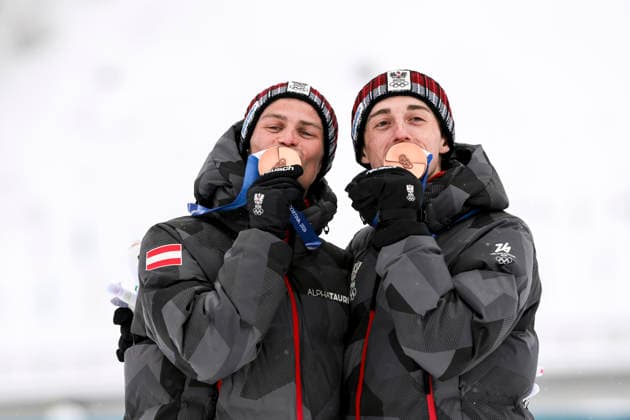 OLYMPICS - Winter Olympic Games, Olympische Spiele, Olympia, OS Milano Cortina 2026 TESERO,ITALY,19.FEB.26 - OLYMPICS, NORDIC SKIING, NORDIC COMBINED - Winter Olympic Games Milano Cortina 2026, team sprint, medal ceremony. Image shows the rejoicing of Johannes Lamparter and Stefan Rettenegger (AUT). Keywords: medal.  GEPAxpictures xMatthiasxTrinkl