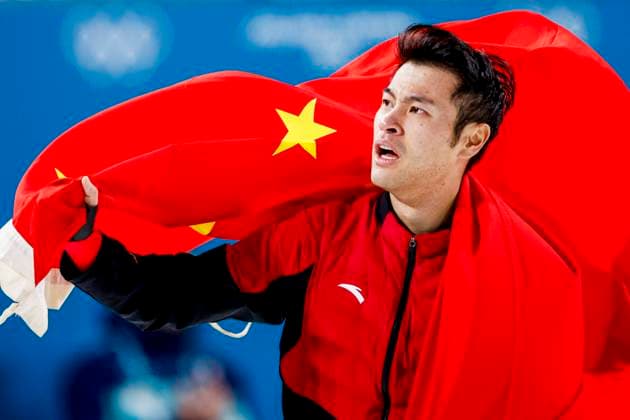 winner Zhongyan Ning of China celebrating and holding flag after Men s 1500m, Milano Cortina 2026 Winter Olympics: Day 13, Speed skating, Eisschnelllauf - Milano Cortina 2026 Winter Olympics: Day 13, Milano Speed Skating Stadium, February 19, 2026, Milan, Italy.