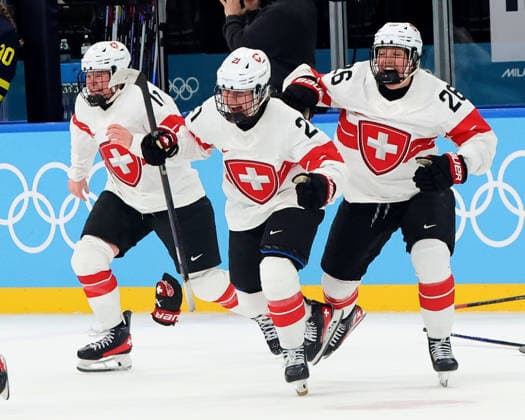 February 19, 2026, Milan, Lombardy, Italy: Rahel Enzler 21 of Team Switzerland and Laura Zimmermann 11 of Team Switzerland and Alina Marti 28 of Team Switzerland celebrate their overtime win over Team Sweden in the women s Ice hockey, Eishockey bronze medal game during the Milano Cortina 2026 Olympic Winter games, Winterspiele,Spiele, Summer games at Milano Santagiulia Ice Hockey Arena. Olympics 2026: Milano Cortina: Ice Hockey-Women Finals - Bronze Medal Game-SWE V SUI  - ZUMAm117 20260219_oly_m117_021 Copyright: xDavidxMcIntyrex