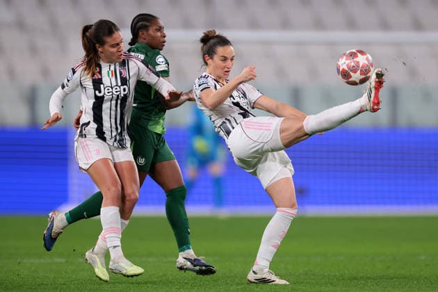 Turin, Italy, 19th February 2026. Martina Lenzini of Juventus clears the ball as Estela Carbonell of Juventus and Lineth Beerensteyn of VfL Wolfsburg close in during the Juventus Women vs VfL Wolfsburg Women UEFA Womens Champions League match at Juventus Stadium, Turin. Picture credit should read: Jonathan Moscrop Sportimage EDITORIAL USE ONLY. No use with unauthorised audio, video, data, fixture lists, club league logos or live services. Online in-match use limited to 120 images, no video emulation. No use in betting, games or single club league player publications. SPI_011_JUVE_WOLFSBURG_UWCL_ SPI-4527-0011