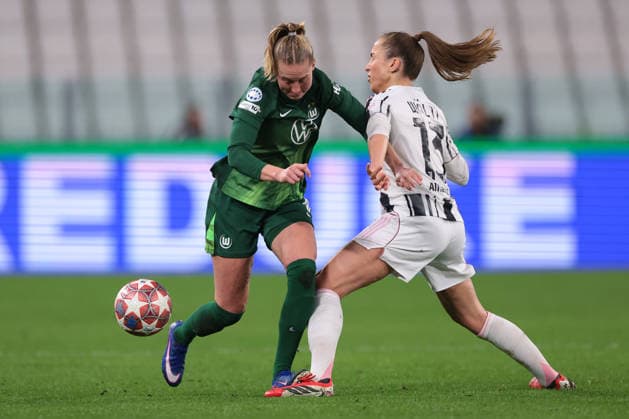 Turin, Italy, 19th February 2026. Camilla Kuver of VfL Wolfsburg takes on Lia Walti of Juventus during the Juventus Women vs VfL Wolfsburg Women UEFA Womens Champions League match at Juventus Stadium, Turin. Picture credit should read: Jonathan Moscrop Sportimage EDITORIAL USE ONLY. No use with unauthorised audio, video, data, fixture lists, club league logos or live services. Online in-match use limited to 120 images, no video emulation. No use in betting, games or single club league player publications. SPI_013_JUVE_WOLFSBURG_UWCL_ SPI-4527-0013