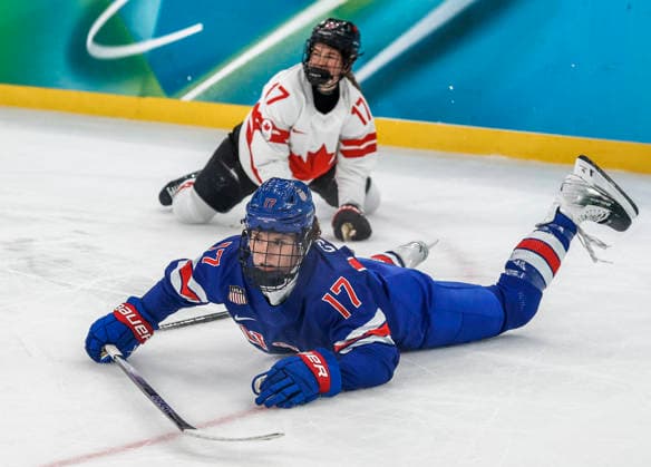 Canada s Ella Shelton (17) trips United States Britta Curl (17) in the first period of the Women s Hockey Gold Medal Game between Canada and the USA at the Milano Santagiulia Ice hockey, Eishockey Arena in Milan, Italy, on Thursday, February 19, 2026.  OLY20260219313 AARONxJOSEFCZYK