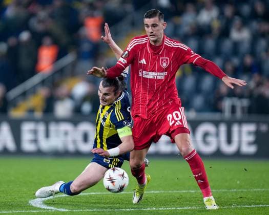 Lorenzo Lucca of Nottingham Forest Football Club and Çaglar Söyüncü of Fenerbahce battle for the ball Fenerbache v Nottingham Forest, UEFA Europa League, Knockout Round Play Offs, First Leg, Football, Sukru Saracoglu Stadium, Istanbul, Turkiye - 19 Feb 2026Istanbul Sukru Saracoglu Stadium Turkey EDITORIAL USE ONLY No use with unauthorised audio, video, data, fixture lists, club league logos or live services. Online in-match use limited to 120 images, no video emulation. No use in betting, games or single club league player publications. Copyright: xRaddadxJebarah Shutterstockx 16674269dr