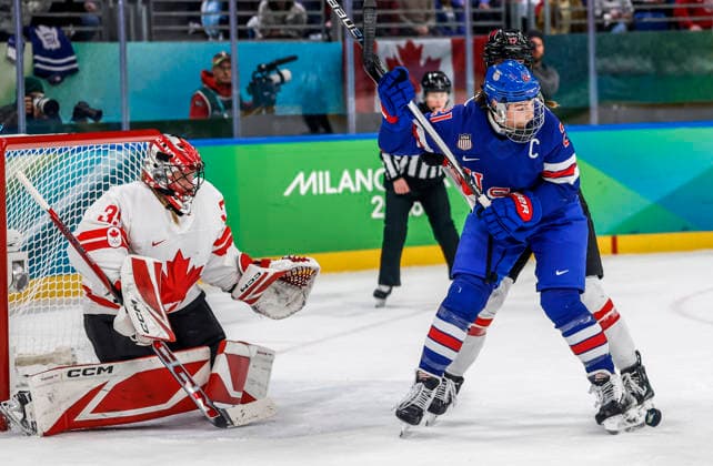 The puck bounces off the skate of United States Hilary Knight (21) in front of Canada s Jocelyne Larocque (3) in the second period of the Women s Hockey Gold Medal Game between Canada and the USA at the Milano Santagiulia Ice hockey, Eishockey Arena in Milan, Italy, on Thursday, February 19, 2026.  OLY20260219323 AARONxJOSEFCZYK