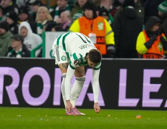 Tomas Cvancara of Celtic removes balls thrown on to the pitch by Celtic fans as protest against the Celtic FC board. Celtic v Stuttgart, UEFA Europa League, Knockout Round Play Offs, First Leg, Football, Celtic Park, Glasgow, Scotland, UK - 19 Feb 2026Glasgow Celtic Park Scotland United Kingdom EDITORIAL USE ONLY No use with unauthorised audio, video, data, fixture lists, club league logos or live services. Online in-match use limited to 120 images, no video emulation. No use in betting, games or single club league player publications. Copyright: xStuartxWallace Shutterstockx 16674319q