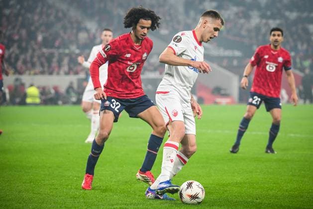 February 19, 2026, Villeneuve-D ascq, France, France: Ayyoub BOUADDI of Lille and Vladimir LUCIC of Crvena Zvezda during the UEFA Europa League match between Lille OSC (LOSC) and Crvena Zvezda at Pierre Mauroy Stadium on February 19, 2026 in Villeneuve-d Ascq near Lille, France. Villeneuve-D ascq France - ZUMAm308 20260219_zsp_m308_003 Copyright: xMatthieuxMirvillex