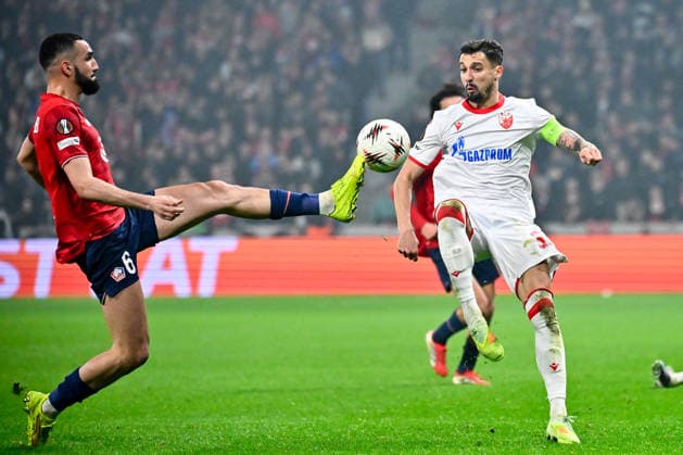 FOOTBALL : Lille vs Etoile Rouge Belgrade - Europa League - Lille - 19 02 2026 Nabil BENTALEB ( 6 - Lille ) and Rade Krunic ( 33 - Red Star Belgrade ) during the UEFA Europa League match between Lille OSC and Red Star Belgrade at Stade Pierre Mauroy on February 19, 2026 in Lille, France. ( Photo by Federico Pestellini PsnewZ ) - LilleFrance  Copyright: xFedericoxPestellinix