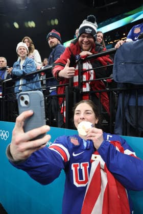 February 19, 2026, Milan, Lombardy, Italy: Hilary Knight 21 of Team United States celebrates with fans after their win over Team Canada in the women s Ice hockey, Eishockey gold medal game during the Milano Cortina 2026 Olympic Winter games, Winterspiele,Spiele, Summer games at Milano Santagiulia Ice Hockey Arena. Olympics 2026: Milano Cortina: Ice Hockey-Women Finals - Gold Medal Game-USA V CAN  - ZUMAm117 20260219_oly_m117_076 Copyright: xDavidxMcIntyrex