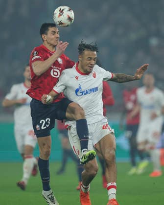 Lille v Crvena Zvezda, UEFA Europa League knock out play-offs 1st leg, season 2025 2026 Aissa Mandi (L) of Lille jump for the ball against Jay Enem (R) of Crvena Zvezda during the UEFA Europa League 2025 26 League play-offs1st leg match between Lille and FK Crvena Zvezda at Stadium Pierre Mauroy on February 19, 2026 in Lille, France. Lille France Copyright: xPedjaxMilosavljevic STARSPORTx x