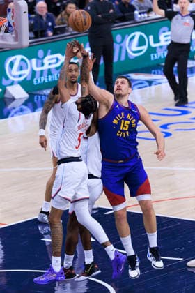 February 19, 2026, Inglewood, California, USA: Nikola Jokic 15 of the Denver Nuggets and Derrick Jones Jr. 5 of the Los Angeles Clippers reach for the rebound during their regular season NBA, Basketball Herren, USA game on Thursday February 19, 2026 at Intuit Dome in Inglewood, California. ARIANA RUIZ PI Inglewood USA - ZUMAp124 20260219_zaa_p124_007 Copyright: xArianaxRuizx