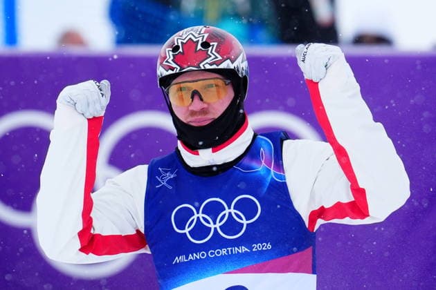 February 20, 2026, Livigno, Italy: Canada s Lewis Irving pumps his fists after his first run during the men s aerials final at the Milano Cortina 2026 Winter Olympic Games, Olympische Spiele, Olympia, OS in Livigno, Italy, Friday, Feb. 20, 2026. Canada News - February 20, 2026  - ZUMAc35_ 20260220_zaf_c35_020 Copyright: xSeanxKilpatrickx