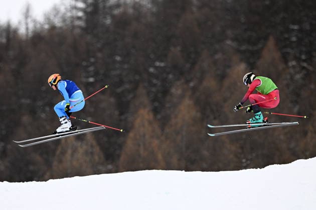 2026 WINTER Olympic Games, Olympische Spiele, Olympia, OS Jole Galli of Italy and Katrin Ofner of Austria compete in the quarterfinal of the Women™s Ski Cross at Livigno Snow Park, on day 14 of the 2026 Milano Cortina Winter Olympic Games in Italy, Friday, February 20, 2026. ( NO ARCHIVING, EDITORIAL USE ONLY LIVIGNO SONDRIO ITALY  Copyright: xDANxHIMBRECHTSx 20260221160295822905