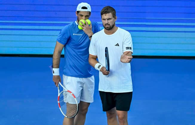 ATP, Tennis Herren Qatar ExxonMobil Open-Doubles Final Julian Cash (L) and Lloyd Glasspool of Great Britain competes against Harri Heliovaara of Finland and Henry Patten of Great Britain in the Doubles Final match at the ATP men s Qatar ExxonMobil Open 2026 tennis tournament at the Khalifa International Tennis Complex in Doha, Qatar, on February 20, 2026. DOHA Qatar Copyright: xNOUSHADx