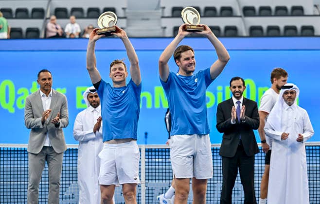 ATP, Tennis Herren Qatar ExxonMobil Open-Doubles Final Harri Heliovaara of Finland and Henry Patten of Great Britain celebrate with their trophies after winning their menÕs Doubles Final match against Julian Cash and Lloyd Glasspool of Great Britain during the ATP Qatar ExxonMobil Open 2026 tennis tournament at the Khalifa International Tennis Complex in Doha, Qatar, on February 20, 2026. DOHA Qatar Copyright: xNOUSHADx