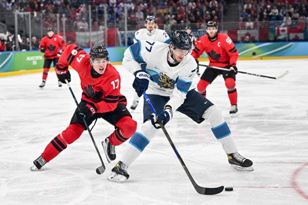 MILAN, ITALY - FEBRUARY 20: Niko Mikkola of Finland R) chased by Macklin Celebrini of Canada L) during the Ice hockey, Eishockey Men™s Play-offs Semifinals match between Canada and Finland on day fourteen of the Milano Cortina 2026 Winter Olympic Games, Olympische Spiele, Olympia, OS at Milano Santagiulia Ice Hockey Arena on February 20, 2026 in Milan, Italy. Milan Milano Santagiulia Ice Hockey Arena Italy *** MILAN, ITALY FEBRUARY 20 Niko Mikkola of Finland R chased by Macklin Celebrini of Canada L during the Ice Hockey Men™s Play offs Semifinals match between Canada and Finland on day fourteen of the Milano Cortina 2026 Winter Olympic games at Milano Santagiulia Ice Hockey Arena on February 20, 2026 in Milan, Italy Milan Milano Santagiulia Ice Hockey Arena Italy Copyright: xJustPictures.ch AndreaxBrancax jp-en-EuSpIm-AB-AAB_290220022026