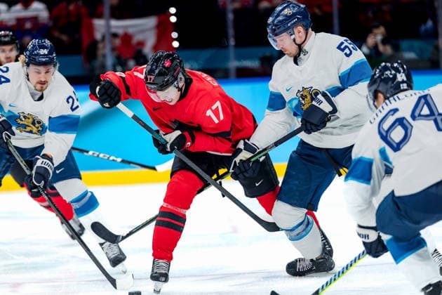 OLYMPICS - Winter Olympic Games, Olympische Spiele, Olympia, OS Milano Cortina 2026 MILAN,ITALY,20.FEB.26 - OLYMPICS, Ice hockey, Eishockey - Winter Olympic Games Milano Cortina 2026, semifinal, Canada vs Finland, men. Image shows Roope Hintz (FIN), Macklin Celebrini (CAN) and Rasmus Ristolainen (FIN).  GEPAxpictures xMatthiasxTrinkl