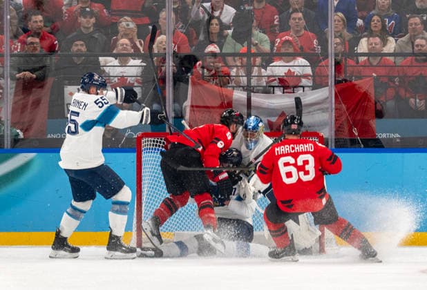 February 20, 2026, Milan, Lombardy, Italy: Team Canada knocks a Finnish player into the net in the first period of their semifinals at Milano Santaguilia Ice hockey, Eishockey Arena during the Milano Cortina 2026 Winter Olympics. Milan Italy - ZUMAh234 20260220_oly_h234_001 Copyright: xMarkxEdwardxHarrisx
