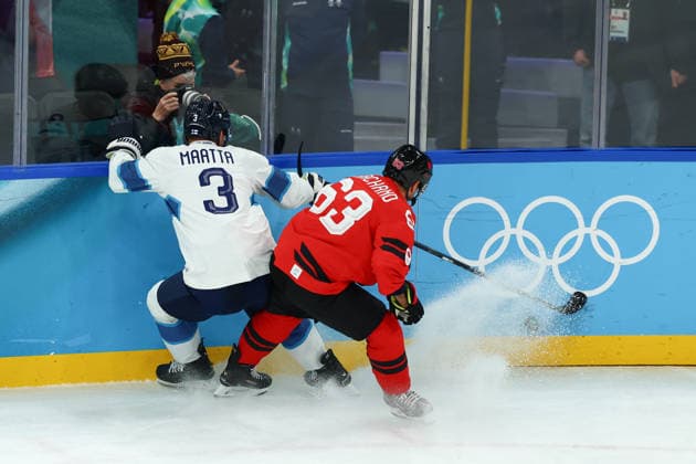 February 20, 2026, Milan, Lombardy, Italy: OLLI MAATTA 3 of Finland and BRAD MARCHAND 63 of Canada contest the puck in the Semifinal game between Team Canada (CAN) and Team Finland (FIN) at the Milano Cortina 2026 Olympic Games, Olympische Spiele, Olympia, OS Olympics 2026: Milano Cortina: Ice hockey, Eishockey Men: CAN:FIN  - ZUMAc179 20260220_oly_c179_017 Copyright: xMickaelxChavetx