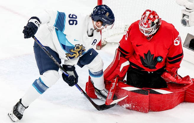 ITALY, MILAN - FEBRUARY 20, 2026: Finland s Mikko Rantanen (L) and Canada s goaltender Jordan Binnington are in action in a menâ€™s Ice hockey, Eishockey play-off semifinal match at the Milano Santagiulia Ice Hockey Arena, as part of the 2026 Winter Olympic Games, Olympische Spiele, Olympia, OS Peter Kovalev TASS  89000690