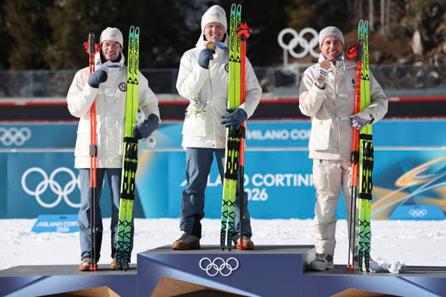 (260220) -- ANTERSELVA, Feb. 20, 2026 -- Gold medalist Johannes Dale-Skjevdal (C) of Norway, silver medalist Sturla Holm Laegreid (L) of Norway, and bronze medalist Quentin Fillon Maillet of France celebrate during the awarding ceremony of the biathlon men s 15km mass start event at the 2026 Milan-Cortina Winter Olympics in Anterselva, Italy, Feb. 20, 2026. ) (MICO2026)ITALY-ANTERSELVA-OLYMPIC Winter games, Winterspiele,Spiele, Summer games BIATHLON-MEN S 15KM MASS START ZhangxTao 