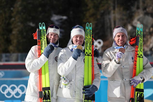 (260220) -- ANTERSELVA, Feb. 20, 2026 -- Gold medalist Johannes Dale-Skjevdal (C) of Norway, silver medalist Sturla Holm Laegreid (L) of Norway, and bronze medalist Quentin Fillon Maillet of France celebrate during the awarding ceremony of the biathlon men s 15km mass start event at the 2026 Milan-Cortina Winter Olympics in Anterselva, Italy, Feb. 20, 2026. ) (MICO2026)ITALY-ANTERSELVA-OLYMPIC Winter games, Winterspiele,Spiele, Summer games BIATHLON-MEN S 15KM MASS START ZhangxTao 