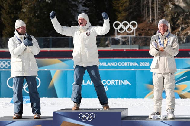 (260220) -- ANTERSELVA, Feb. 20, 2026 -- Gold medalist Johannes Dale-Skjevdal (C) of Norway celebrates during the awarding ceremony of the biathlon men s 15km mass start event at the 2026 Milan-Cortina Winter Olympics in Anterselva, Italy, Feb. 20, 2026. ) (MICO2026)ITALY-ANTERSELVA-OLYMPIC Winter games, Winterspiele,Spiele, Summer games BIATHLON-MEN S 15KM MASS START ZhangxTao 