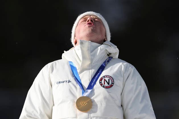 (260220) -- ANTERSELVA, Feb. 20, 2026 -- Gold medalist Johannes Dale-Skjevdal of Norway reacts during the awarding ceremony of the biathlon men s 15km mass start event at the 2026 Milan-Cortina Winter Olympics in Anterselva, Italy, Feb. 20, 2026. ) (MICO2026)ITALY-ANTERSELVA-OLYMPIC Winter games, Winterspiele,Spiele, Summer games BIATHLON-MEN S 15KM MASS START ZhangxTao 