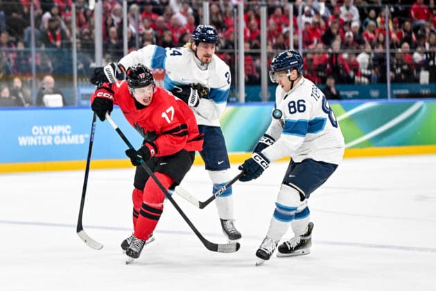 MILAN, ITALY - FEBRUARY 20: Macklin Celebrini of Canada battle for the puck against Roope Hintz of Finland L) and Teuvo Teravainen of Finland R) during the Ice hockey, Eishockey Men™s Play-offs Semifinals match between Canada and Finland on day fourteen of the Milano Cortina 2026 Winter Olympic Games, Olympische Spiele, Olympia, OS at Milano Santagiulia Ice Hockey Arena on February 20, 2026 in Milan, Italy. Milan Milano Santagiulia Ice Hockey Arena Italy *** MILAN, ITALY FEBRUARY 20 Macklin Celebrini of Canada battle for the puck against Roope Hintz of Finland L and Teuvo Teravainen of Finland R during the Ice Hockey Men™s Play offs Semifinals match between Canada and Finland on day fourteen of the Milano Cortina 2026 Winter Olympic games at Milano Santagiulia Ice Hockey Arena on February 20, 2026 in Milan, Italy Milan Milano Santagiulia Ice Hockey Arena Italy Copyright: xJustPictures.ch AndreaxBrancax jp-en-EuSpIm-AB-AAB_382220022026