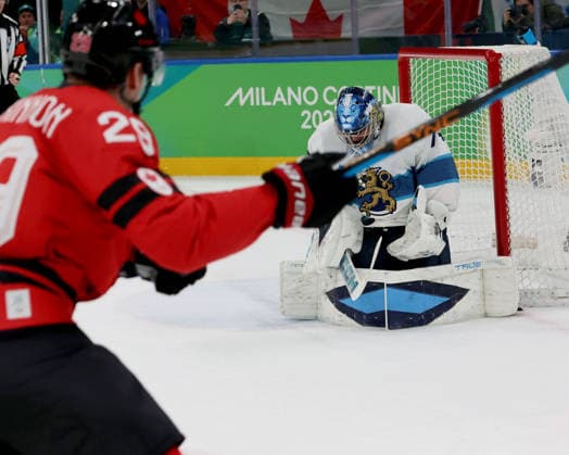February 20, 2026, Milan, Lombardy, Italy: Juuse Saros (74) of Team Finland stops shot by Nathan MacKinnon (29) of Team Canada in a men s Ice hockey, Eishockey semifinal during the Milano Cortina 2026 Olympic Winter games, Winterspiele,Spiele, Summer games at Milano Santagiulia Ice Hockey Arena Milan Italy - ZUMAm117 20260220_oly_m117_019 Copyright: xDavidxMcIntyrex