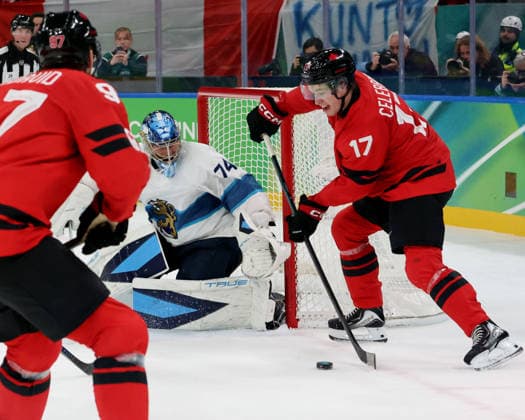 February 20, 2026, Milan, Lombardy, Italy: Macklin Celebrini (17) of Team Canada and Juuse Saros (74) of Team Finland in a men s Ice hockey, Eishockey semifinal during the Milano Cortina 2026 Olympic Winter games, Winterspiele,Spiele, Summer games at Milano Santagiulia Ice Hockey Arena Milan Italy - ZUMAm117 20260220_oly_m117_023 Copyright: xDavidxMcIntyrex