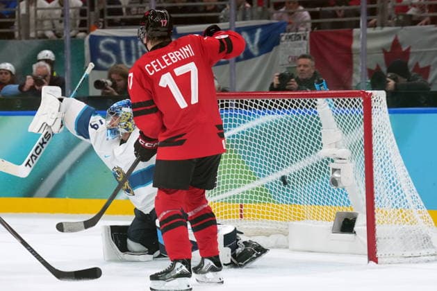 February 20, 2026, Milan, ITALY: Canada forward Macklin Celebrini (17) watches a goal make it past Finland goaltender Juuse Saros (74) during second period Men s Olympic semifinal Ice hockey, Eishockey action at the 2026 Milan Cortina Winter Olympics in Milan, Friday, Feb. 20, 2026. Canada News - February 20, 2026  - ZUMAc35_ 20260220_zaf_c35_054 Copyright: xNathanxDenettex
