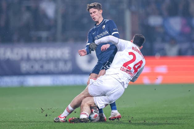 20 02 2026, Football, VfL Bochum 1 FC Nürnberg, 2 Fußball Bundesliga, 23 Matchday, Vonovia Ruhrstadion, Season 2025 2026 Luka Lochoshvili 1FC Nuernberg 24 in duel against Oliver Olsen VfL Bochum 13 DFB regulations prohibit any use of photographs as image sequences and or quasi video Nordrhein Westfalen Germany