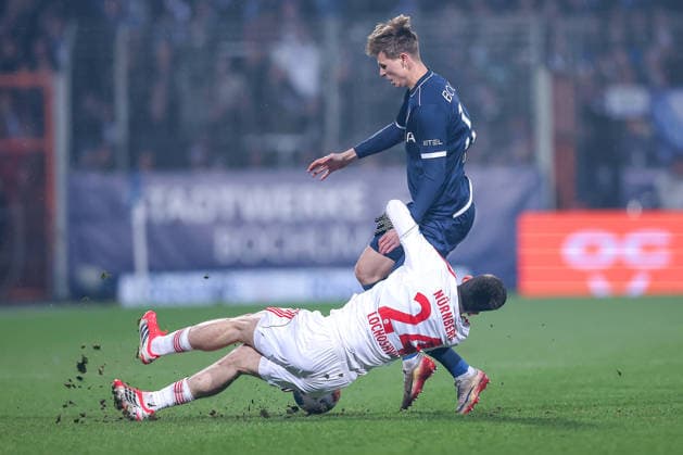 20 02 2026, Football, VfL Bochum 1 FC Nürnberg, 2 Fußball Bundesliga, 23 Matchday, Vonovia Ruhrstadion, Season 2025 2026 Luka Lochoshvili 1FC Nuernberg 24 in duel against Oliver Olsen VfL Bochum 13 DFB regulations prohibit any use of photographs as image sequences and or quasi video Nordrhein Westfalen Germany