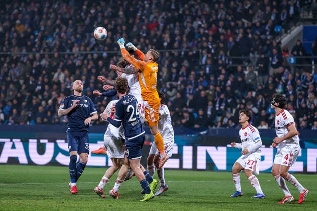 20 02 2026, Football, VfL Bochum 1 FC Nürnberg, 2 Fußball Bundesliga, Matchday 23, Vonovia Ruhrstadion, Season 2025 2026 Penalty area action Goalkeeper Jan Reichert 1FC Nuernberg 01 defends the ball next to Adriano Grimaldi 1FC Nuernberg 33 against Mats Pannewig VfL Bochum 24 and Philipp Hofmann VfL Bochum 33 DFB regulations prohibit any use of photographs as image sequences and or quasi video Nordrhein Westfalen Germany