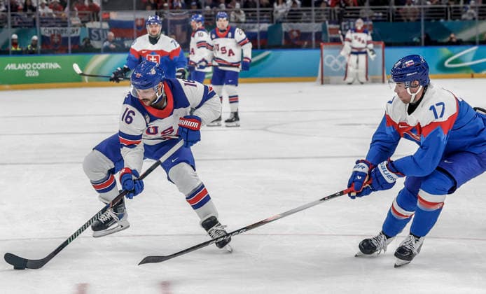 United States Vincent Trocheck (16) keeps the puck away from Slovakia s Simon Nemec (17) in the first period of the Men s Hockey Play-off Semifinal game between Slovakia and the USA at the Milano Santagiulia Ice hockey, Eishockey Arena in Milan, Italy, on Friday, February 20, 2026.  OLY20260220315 AARONxJOSEFCZYK