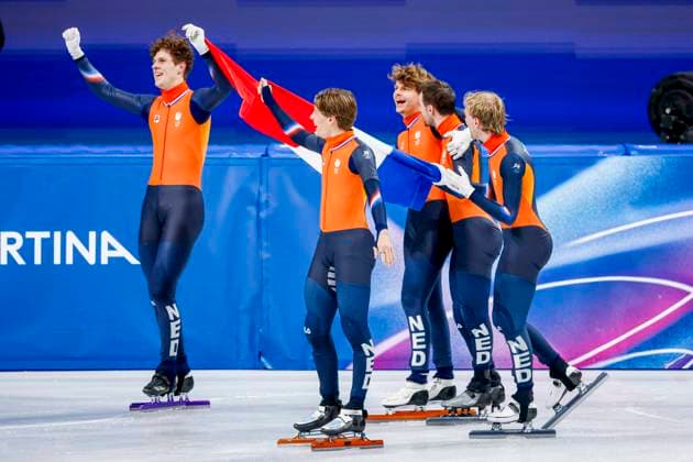 winner team of the Netherlands, Jens van t Wout of the Netherlands and Teun Boer of the Netherlands and Itzhak de Laat of the Netherlands and Friso Emons of the Netherlands and Melle van t Wout of the Netherlands celebrating and holding flag after Men s 5000m Relay Finals, Milano Cortina 2026 Winter Olympics: Day 14, Short Track Speed skating, Eisschnelllauf - Milano Cortina 2026 Winter Olympics: Day 14, Milano Speed Skating Stadium, February 20, 2026, Milan, Italy.