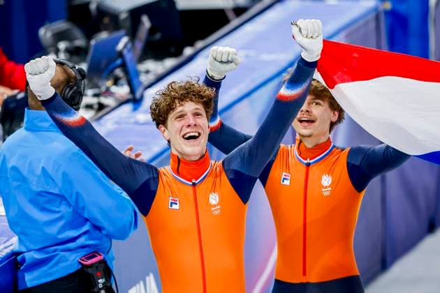 winner team of the Netherlands, Teun Boer of the Netherlands and Melle van t Wout of the Netherlands celebrating and holding flag after Men s 5000m Relay Finals, Milano Cortina 2026 Winter Olympics: Day 14, Short Track Speed skating, Eisschnelllauf - Milano Cortina 2026 Winter Olympics: Day 14, Milano Speed Skating Stadium, February 20, 2026, Milan, Italy.