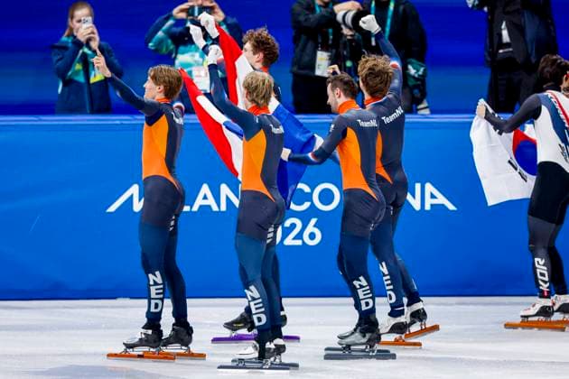 winner team of the Netherlands, Jens van t Wout of the Netherlands and Teun Boer of the Netherlands and Itzhak de Laat of the Netherlands and Friso Emons of the Netherlands and Melle van t Wout of the Netherlands celebrating and holding flag after Men s 5000m Relay Finals, Milano Cortina 2026 Winter Olympics: Day 14, Short Track Speed skating, Eisschnelllauf - Milano Cortina 2026 Winter Olympics: Day 14, Milano Speed Skating Stadium, February 20, 2026, Milan, Italy.